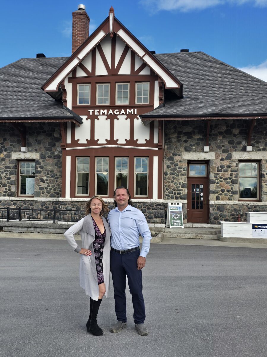 Kris and Sylvia Betkowski in front of Temagami train station